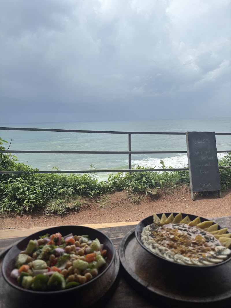 Aum Cafe I Mostly Vegan I Varkala Cliff - Aum Cafe I Mostly Vegan I Varkala Cliff Aum Cafe, Black Beach Road, N Cliff Rd, near S Cliff Resort, Varkala, Kerala 695141, India