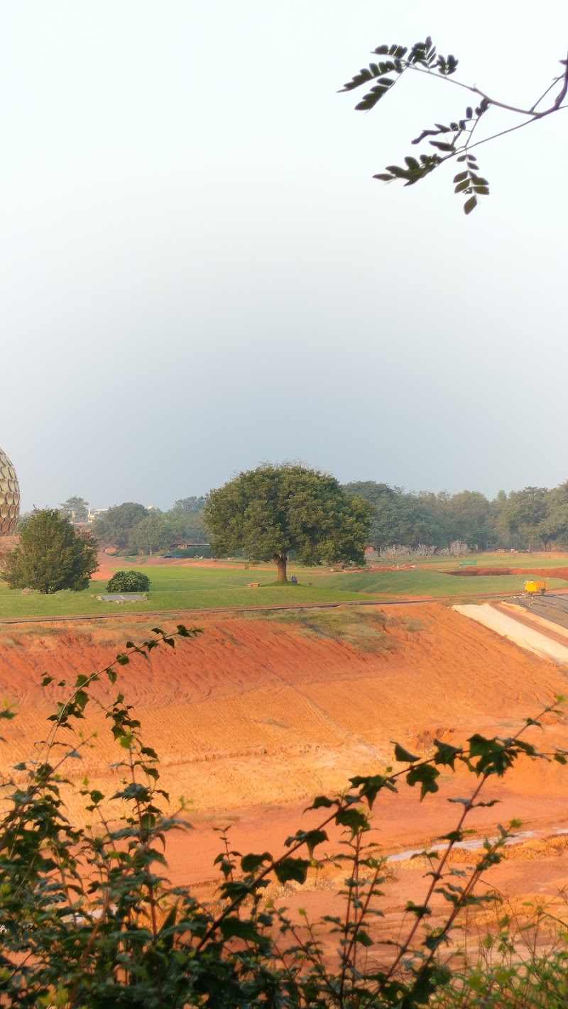 Auroville Visitors Entrance - Auroville Visitors Entrance 2R22+Q8H, Auroville, Irumbai, Tamil Nadu 605101, India