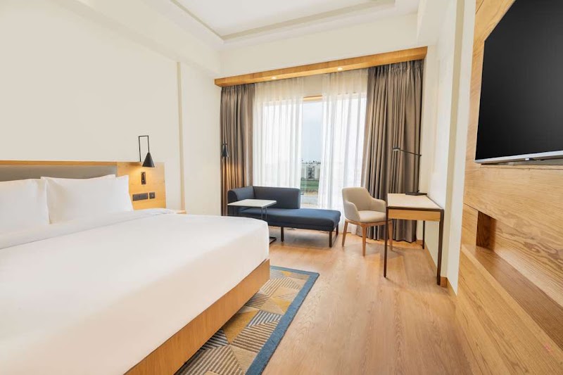Radisson Hotel Vrindavan - Radisson Hotel Vrindavan, Parking, Vrindavan Road, opp. Rukmani Vihar, Chhatikara, Vrindavan, Uttar Pradesh 281121, India