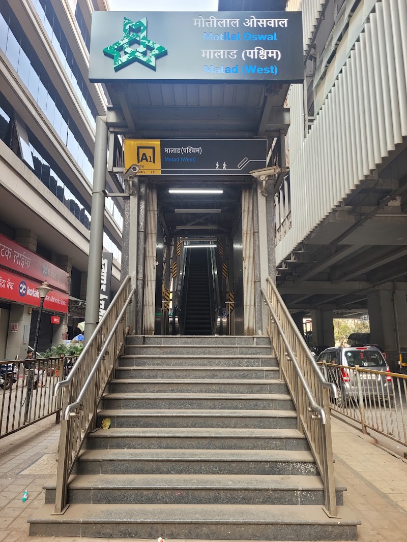 Malad West Metro Station - Malad West Metro Station 1406-A, 16E, New Link Rd, Malad, Mindspace, Malad West, Mumbai, Maharashtra 400064, India